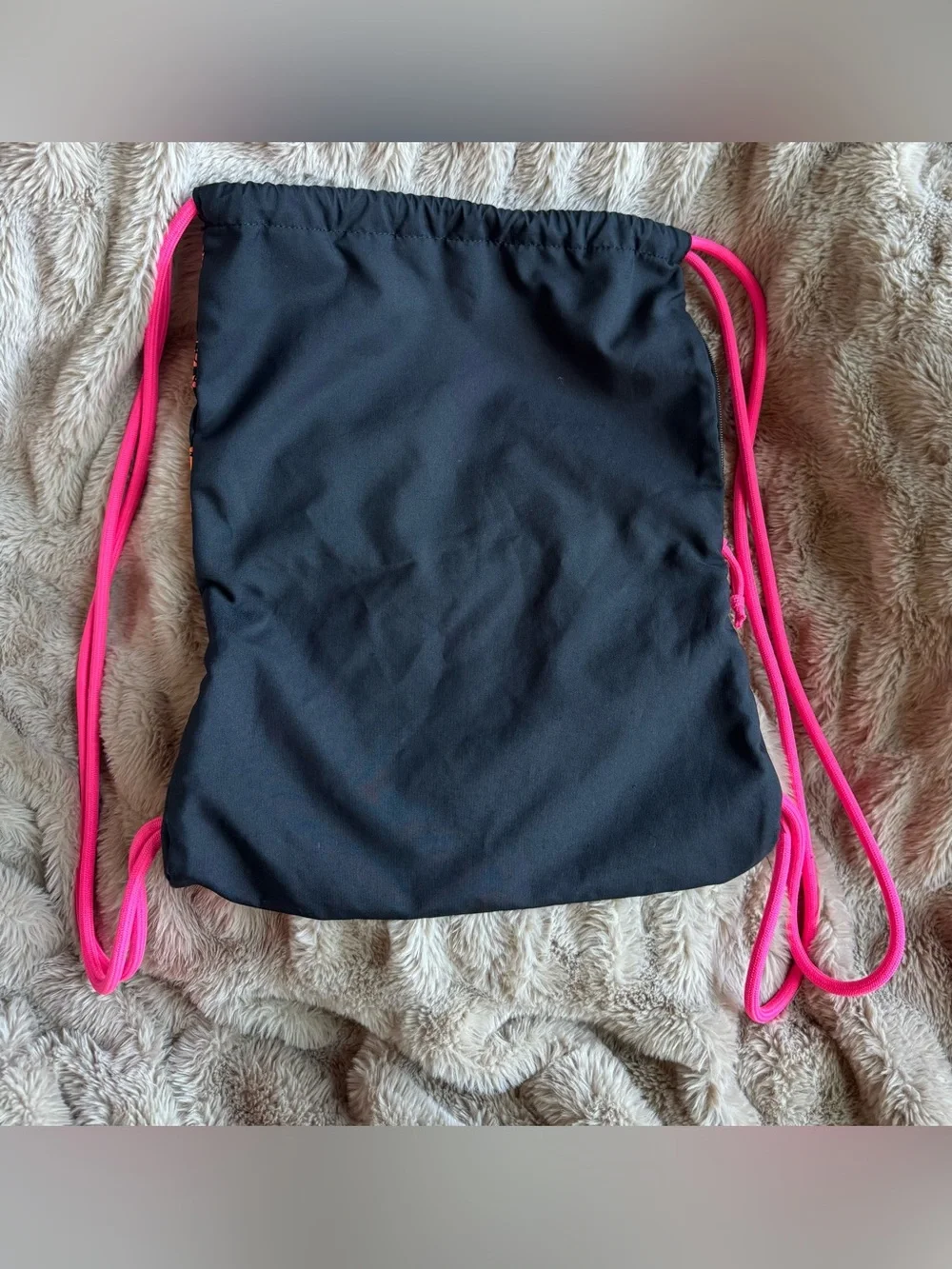 Nike Black Drawstring Backpack with Pink-to-Orange Gradient Logo
